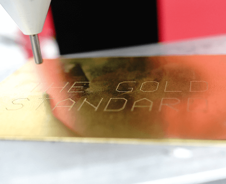 Nadelstempel mit der Aufschrift Gold mit der Aufschrift „The Gold Standard“.