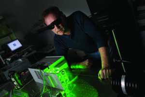 engineer using green laser marker