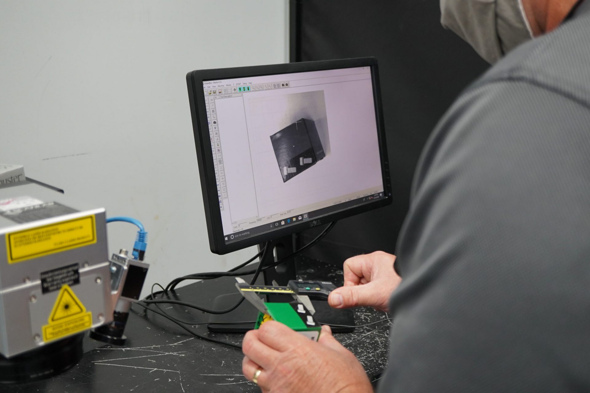 man using Telesis technologies laser marking software